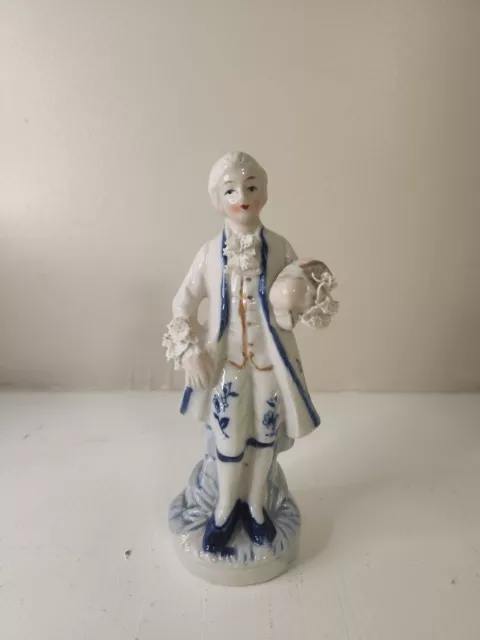 Vintage Blue and White Porcelain Figurine of Colonial Boy