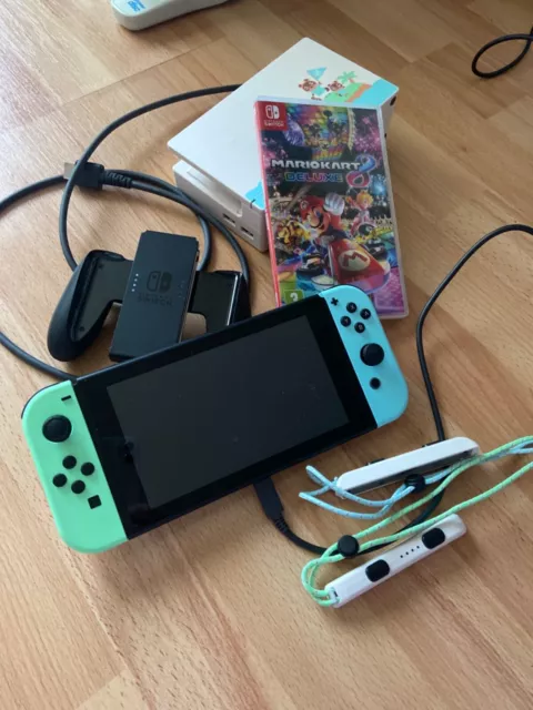 Pre-owned Nintendo Switch console excellent condition green and blue controllers