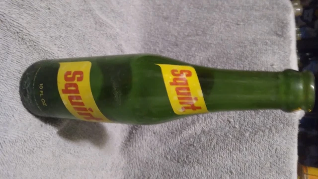 Vintage Green Glass Squirt Soda Bottle 10 Fl Oz 9.5" tall. good condition .