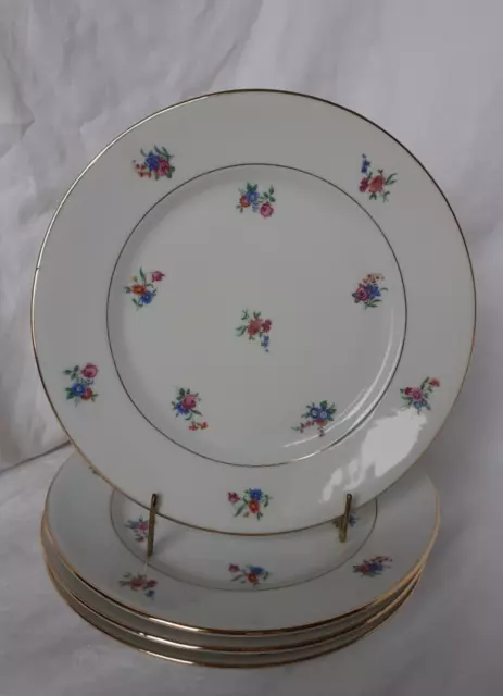 4 assiettes plates en porcelaine de Limoges décor semi de fleurs