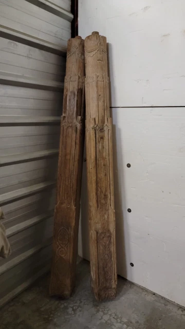 pair of antique carved wood columns salvaged from old building  measuring 7'3"