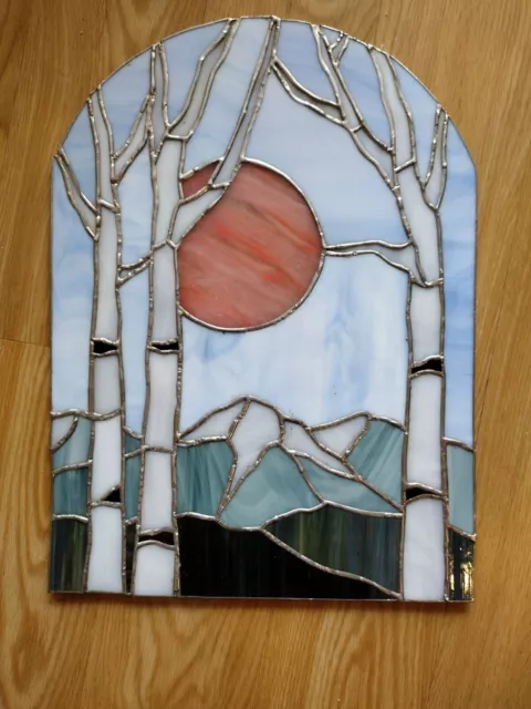 Beautiful stain glass panel showing white birch trees sun & mountains scene