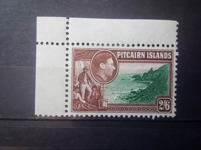 Pitcairn island 1940 SG 8, 2s.6d. green and brown MNH hinge on border. Cat £10.