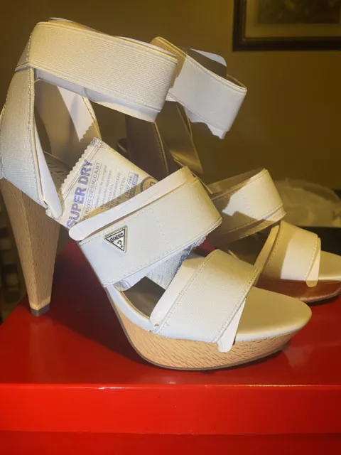 Guess heels size 7M color white , G for guess los angeles heels new with box