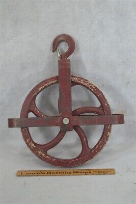 old well wheel pulley primitive cast iron 15 in swivel hook early 19th c
