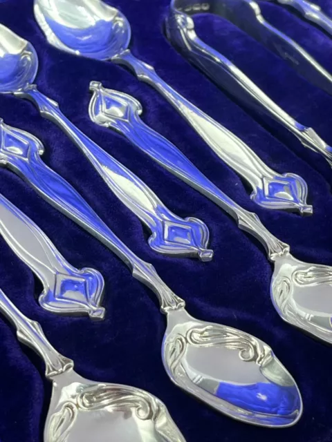 A fabulous set of silver art nouveau 12 tea spoons & tongs Sheffield 1905