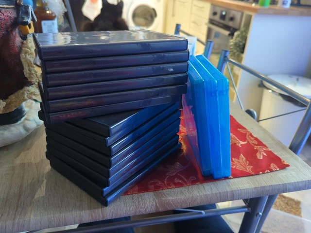 14 empty single dvd cases And 3 Empty Blue Ray Cases