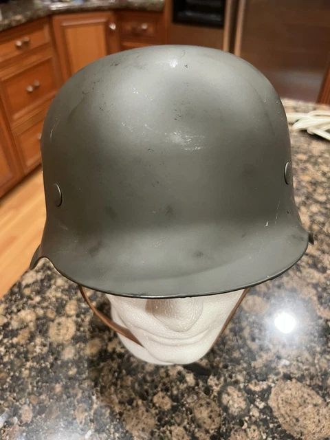 German WWII third reich Helmet.  Helmet weighs approx. 3 lbs. Numbered 2407
