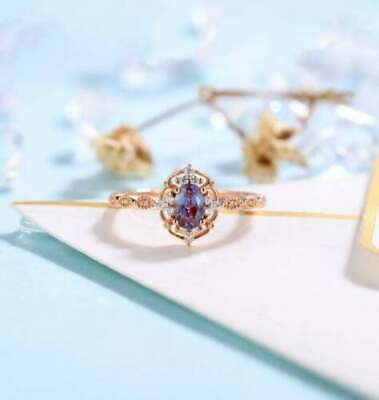 Lab-Created 2.50 Ct Oval Cut Blue Alex Halo Engagement Ring 14K Rose Gold Over
