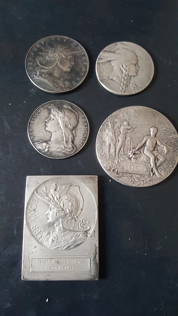 Lot de 4 medailles en argent massif et 1plaque en bronze argente