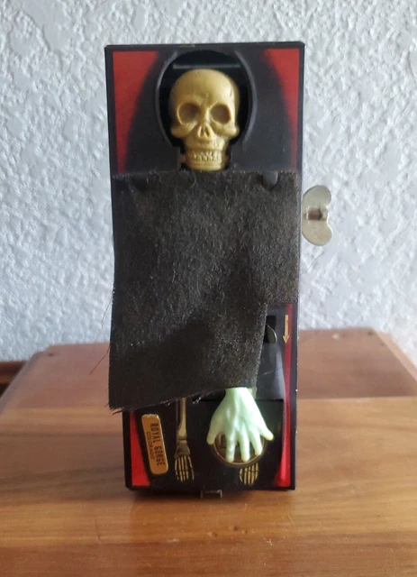 Lot - A Vintage Tin-Plate Wind-Up Coffin Novelty Money Box, Yone Japan