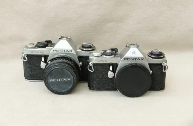 Pentax ME and ME Super camera bodies, one with lens - parts only
