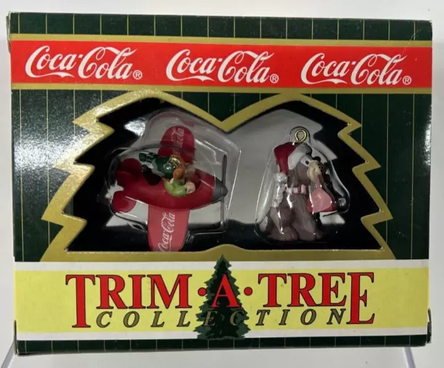 Coca Cola Trim A Tree Collection Ornaments "Elf and a Dog On Plane" (1996)