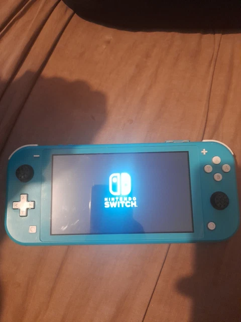 Nintendo Switch Lite  HS car bloqué sur le Logo Nintendo vendue en l'état