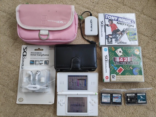 Nintendo DS lite console bundle. Games, cases, inner ear phone, etc