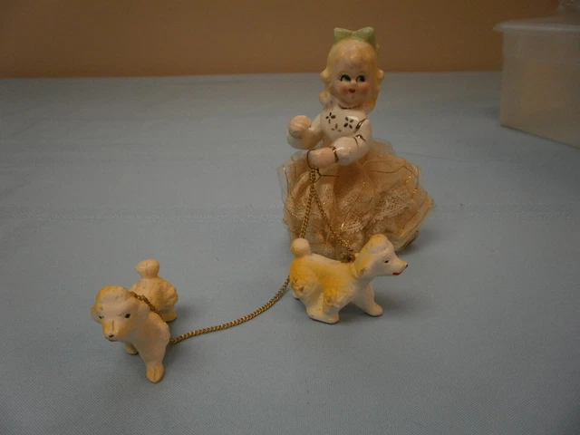Vtg Artmark Ceramic girl figurine lace w big eyes with 2 Yellow poodles on chain