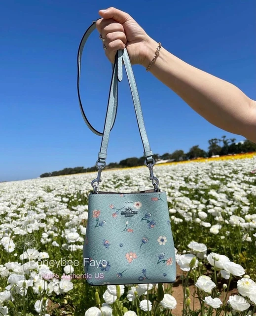 Coach small town bucket bag with heart floral print online
