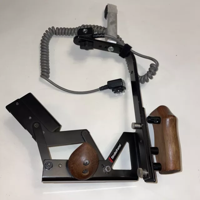 Stroboframe Professional Camera Bracket w/ Nikon SC-17 Flash Cord PRE-OWNED Stroboframe Professional Camera Bracket w/ Nikon SC-17 Flash Cord PRE-OWNED
