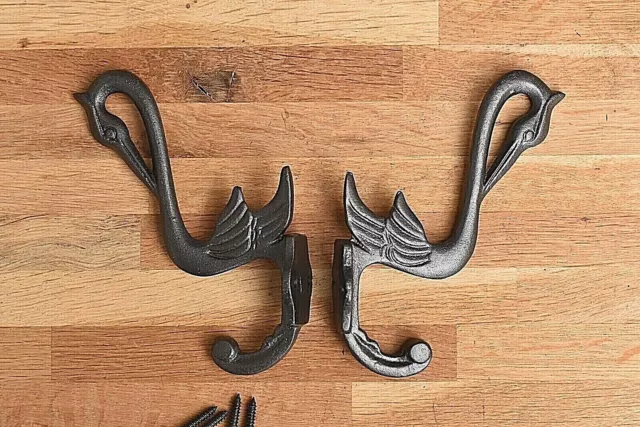 A pair of Arts & Crafts cast iron heron coathook wall door hanger coat hook