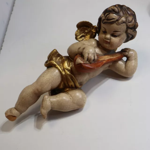 Musizierender Putto, geschnitzt, farbig gefasst, 24 cm       G206A