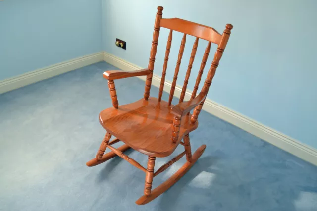 Pine colonial-style rocking chair in like-new condition, suit nursery