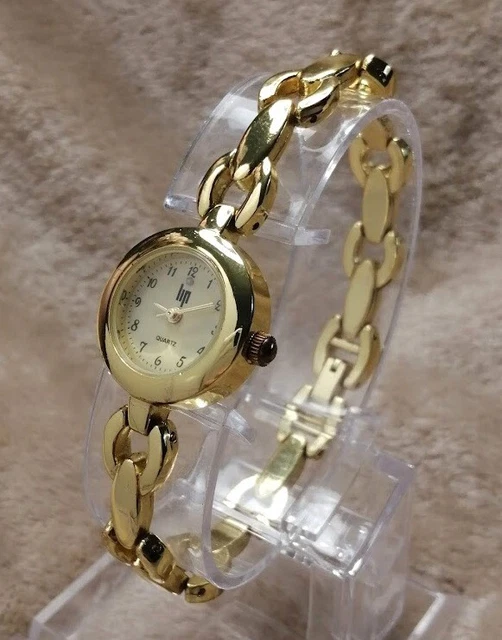 Montre Femme Lip Vintage à Quartz - Boîtier Doré Acier, Cadran Blanc - Bracelet Cuir Marron - Occasion