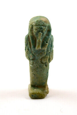 Egypt Late Period, 26th-30th Dynasty  a green faience glazed shabti