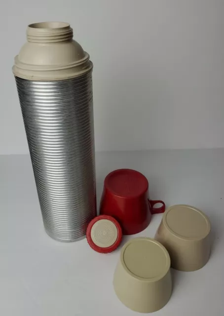 https://www.picclickimg.com/xzEAAOSwupFgibtX/Vintage-Aluminum-Ribbed-Thermos-Brand-Vacuum-Bottle-Model.webp
