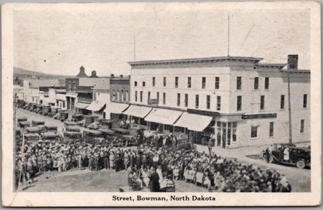 BOWMAN North Dakota Postcard Main Street / Downtown Scene / Crowd - 1938 Cancel