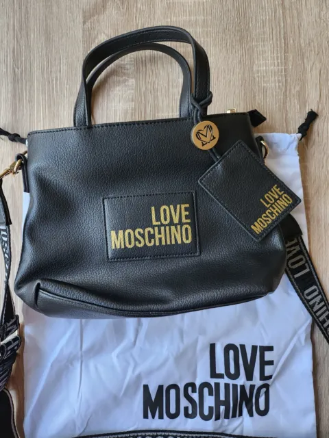 tres beau Sac à main Love Moschino noir et doré en parfait état