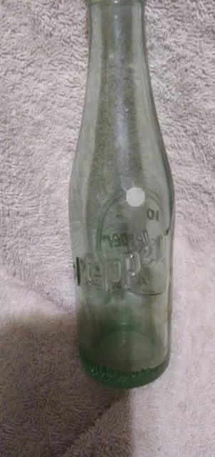 1954 Dr. Pepper 6 oz. Embossed. 10-2-4 On One Side. Angled Dr Pepper On Opposite
