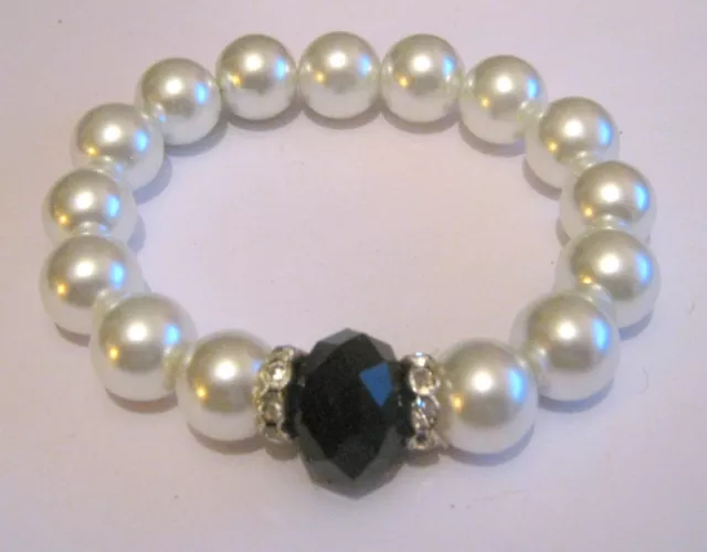 Lovely silver tone faux pearl beaded elasticated bracelet faceted black bead
