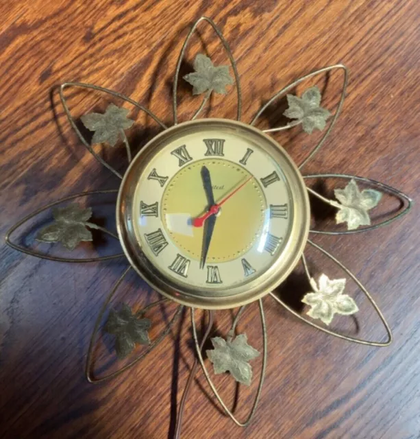 Vintage United Clock Corp Wall Electric Clock Star/ Flower/Sun Design Works Good