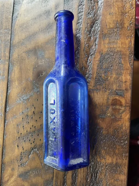 Laxol A J White New York Embossed hand blown cobalt blue medicine bottle