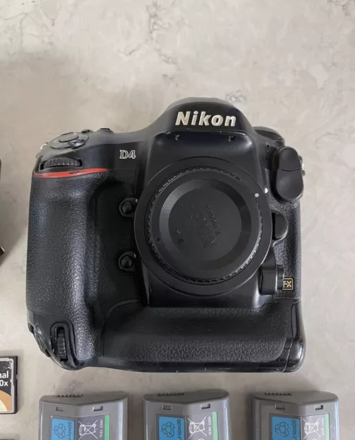 Nikon D4 16.2MP Digital SLR Camera Body w/ 3 Batteries Charger ,memory cards