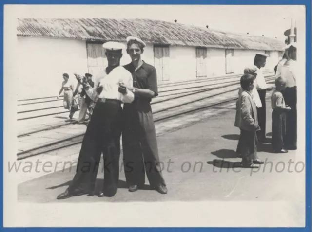Two handsome guys stand in an embrace Sailor Gay Int Vintage photo