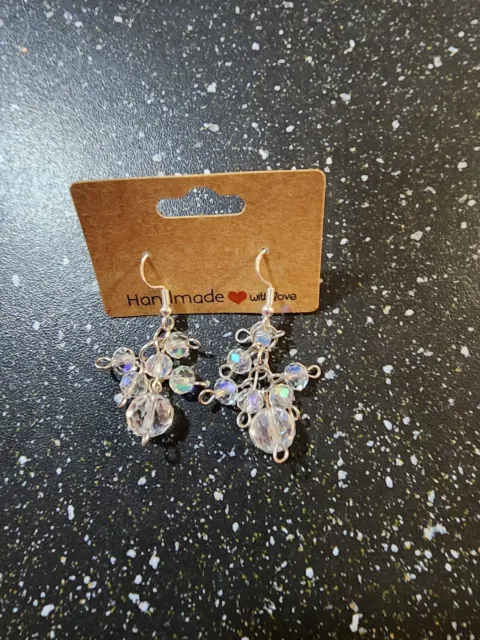 Hand beaded earrings made with a cluster of clear crystal beads