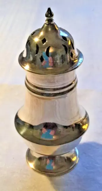 Vintage silver plated sugar shaker. 6 inches tall. Very good condition.