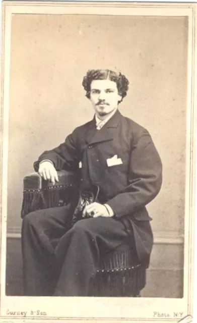 CIVIL WAR ERA PORTRAIT OF WELL-DRESSED YOUNG MAN HOLDING A CAP or SHOE