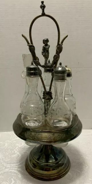 https://www.picclickimg.com/yToAAOSwqMxgumRj/Antique-Meriden-Silverplate-Condiment-Cruet-Set-PUTTI-Handle.webp