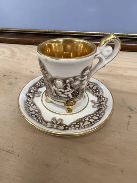 Capodimonte Italy Cherubs gold trim demitasse tea cup and saucer