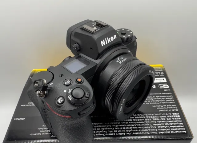 Nikon Z7II - with 28mm lens and 1TB card  &  less than 2550 shutter count
