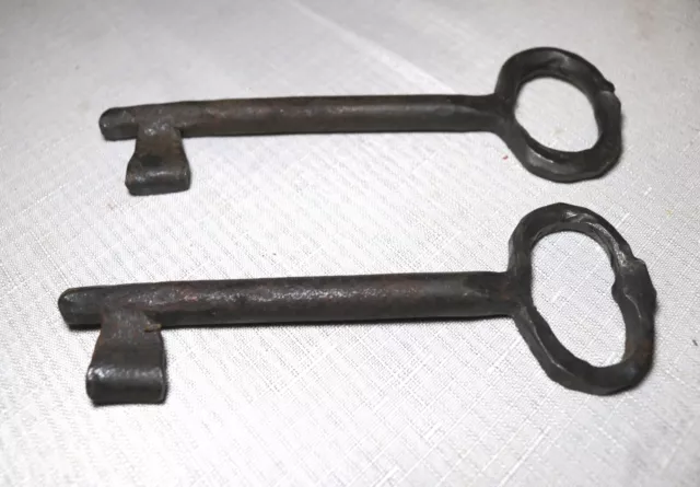 pair of 2 large antique hand forged wrought iron skeleton lock keys