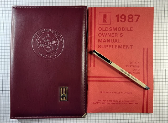 1987 90th Anniversary Oldsmobile Manual Cover w/ Pen & Supplement