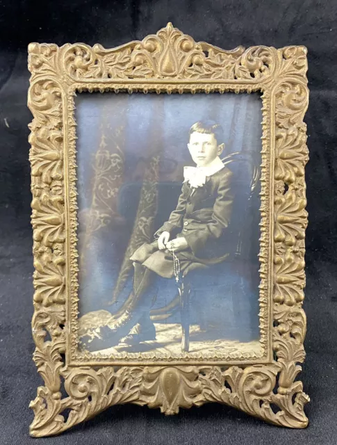 https://www.picclickimg.com/yh4AAOSw8EtkljUR/Antique-Photo-Boy-With-Rosary-Metal-Picture-Frame.webp