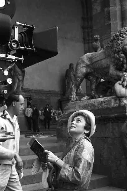 Olivia de Havilland holding the city guide of Florence in the film- Old Photo