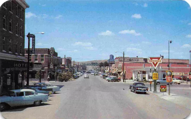 Street Scene Cars Conoco Gas Sign Police Car Lusk Wyoming 1950s postcard