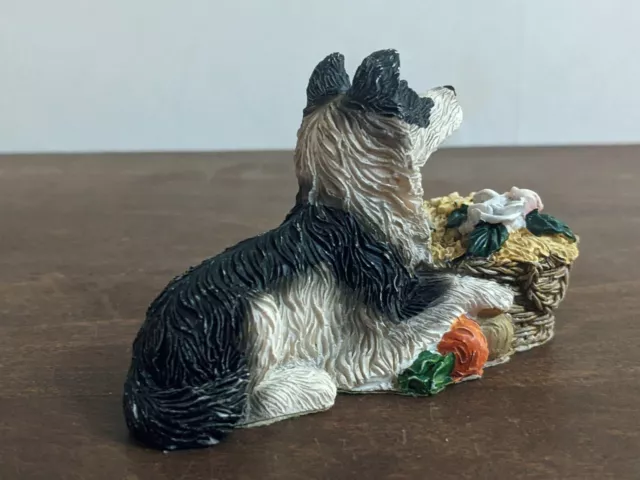 Pottery Border Collie with a garden basket. Size 9cm x 4cm.