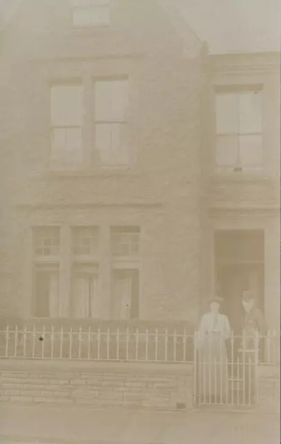 VINTAGE Sepia VERY FADED Real Photo Man & Woman Outside Stone House POSTCARD
