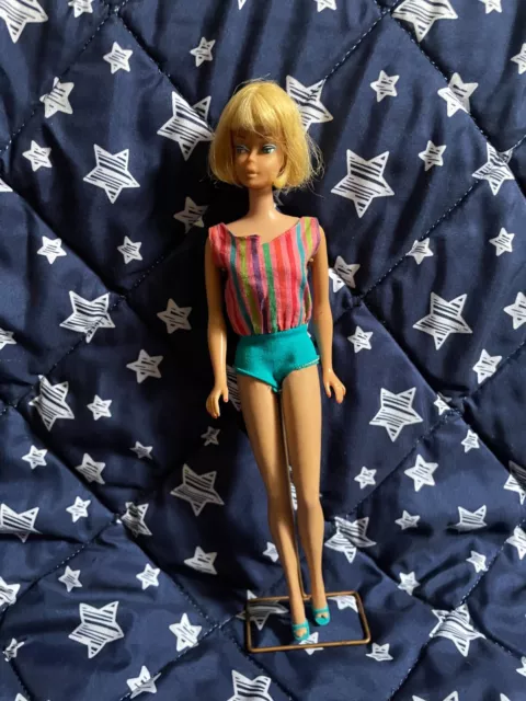 vintage barbie doll 1966s.  Posable legs. Blonde bob cut hair. Original swimwear